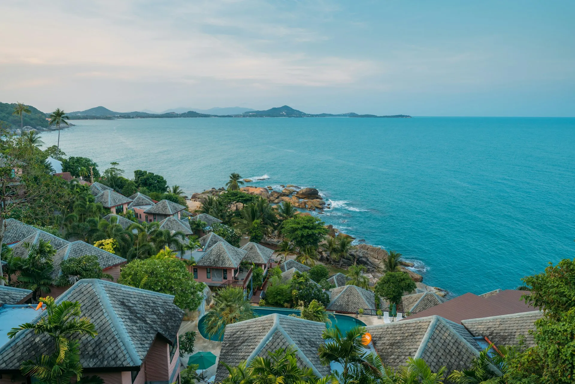 Aerial view of Koh Samui coastline with turquoise waters and luxury villas